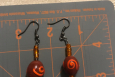 Rust and orange dangle earrings