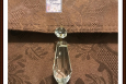 Crystal purse charm on brown purse