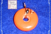Orange wire wrapped pendant